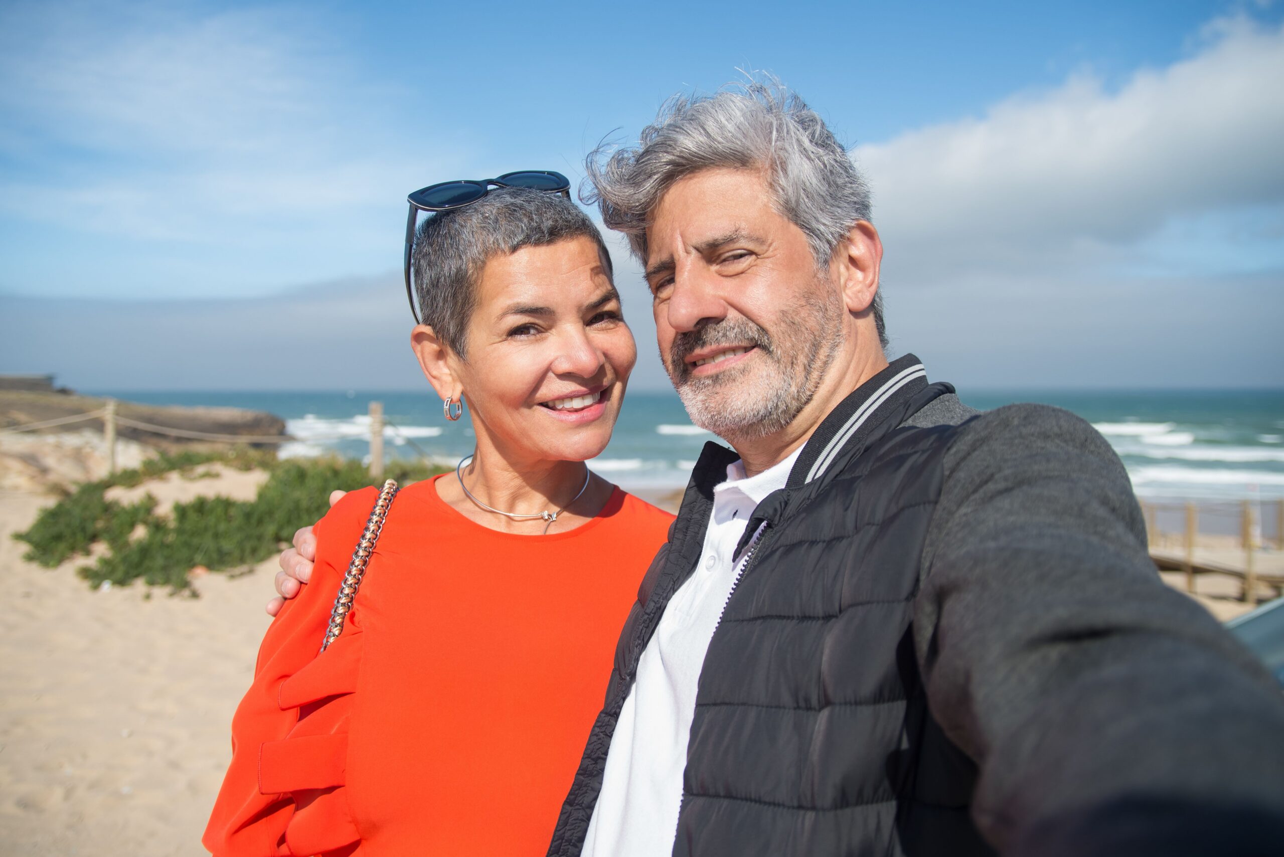 Couple smiling together on a beach