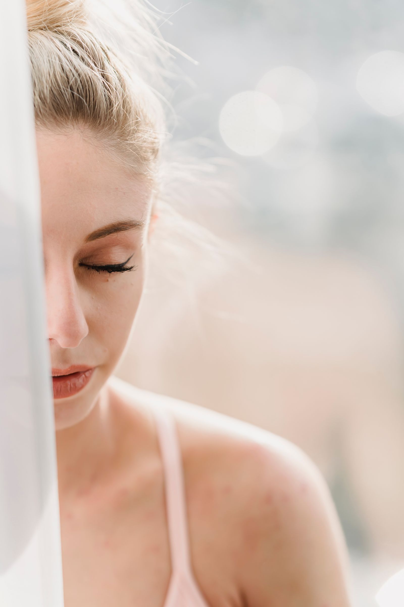 Woman waking up refreshed in soft morning light