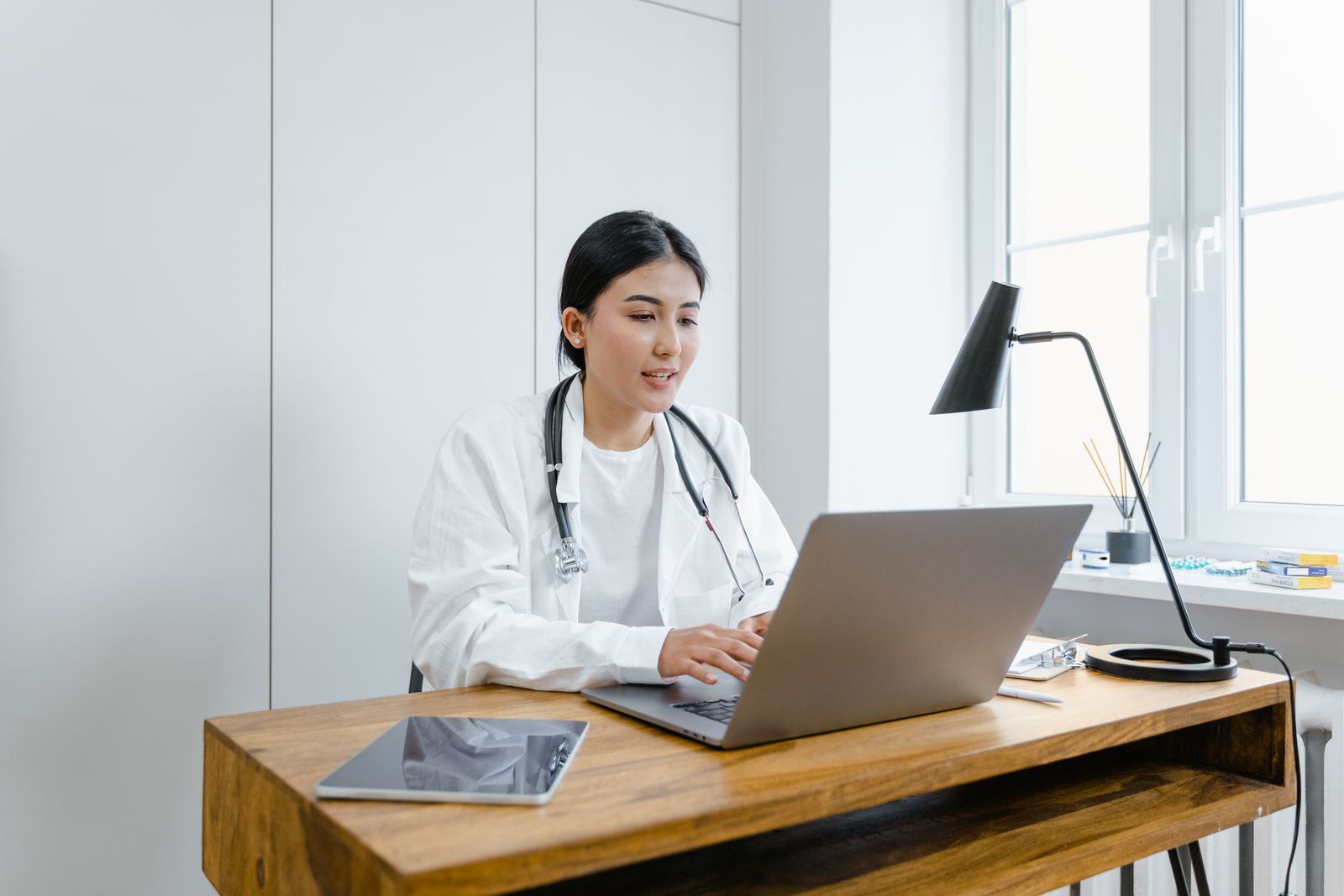 Board-certified doctor reviewing a patient plan