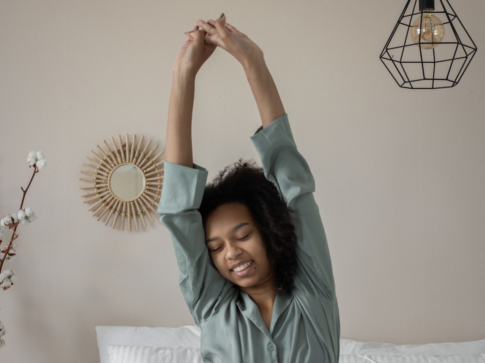 Woman stretching happily after a restful night